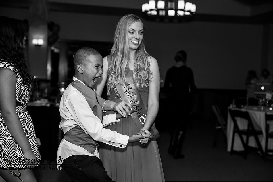 suprise boy because of a dance move on the floor at Wiens family cellars temecula winery by temcula wedding photographer