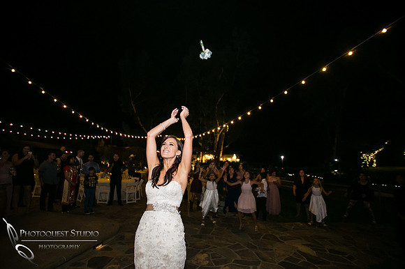Wedding bouquet toss at Lake Oak Meadows, Temecula Winery by Photographer of Photoquest Studio