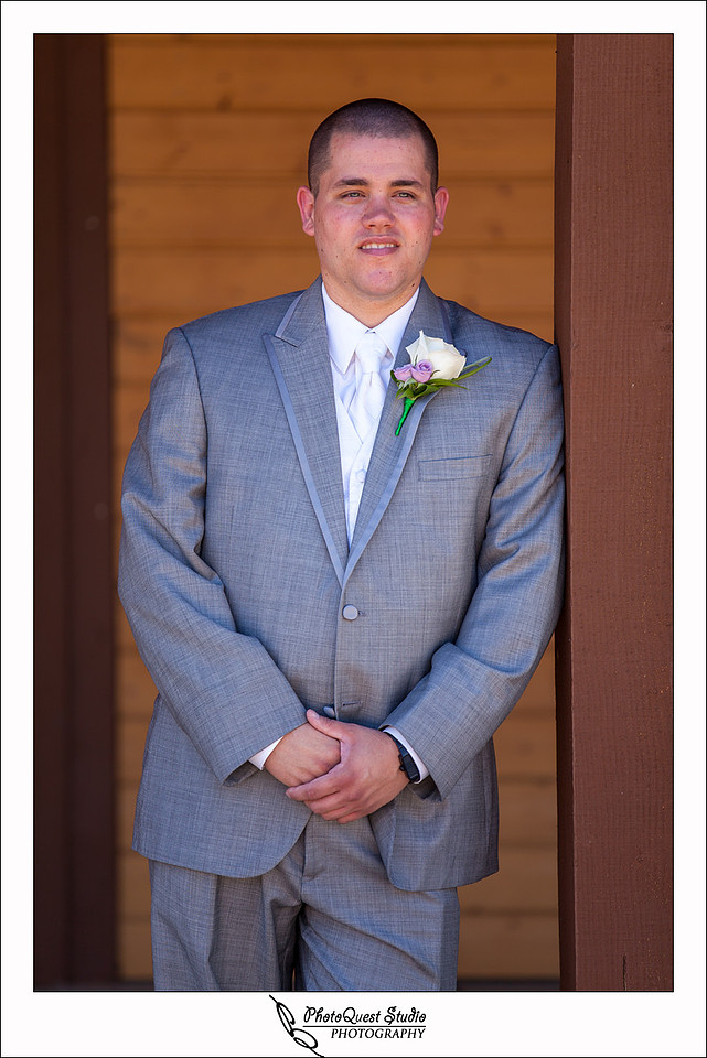 Longshadow Ranch Wedding Photography, Temecula Vineyard and Winery Wedding Photographer - PhotoQuest Studio, the groom posing by the pole