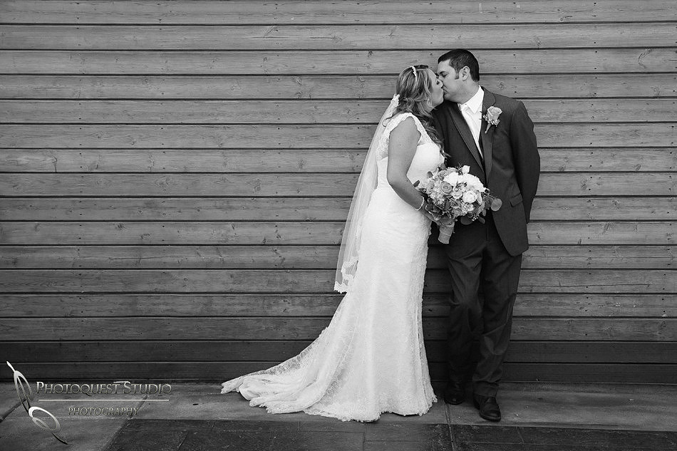 Kissing at Longshadow Ranch Winery wedding by Wedding Photographer in Temecula