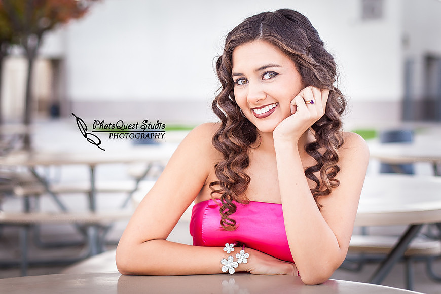 High School Senior photos session of beautiful Latina Teen from Menifee, California - Miss Isabel Donadio.  Location: Paloma Valley High School, Menifee, CA.  Photography: PhotoQuest Studio - Menifee Wedding, Family and Event Photographer, sitting at lunch table