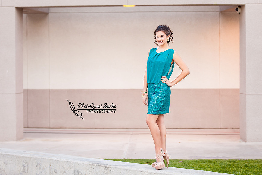High School Senior photos session of beautiful Latina Teen from Menifee, California - Miss Isabel Donadio.  Location: Paloma Valley High School, Menifee, CA.  Photography: PhotoQuest Studio - Menifee Wedding, Family and Event Photographer, standing by the library