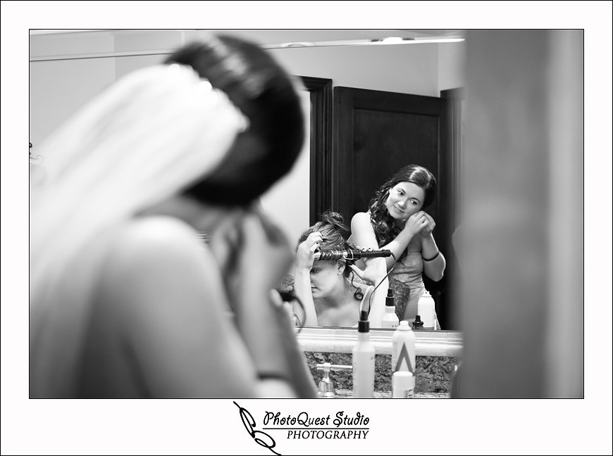 South Coast Winery Wedding Photography by Temecula, Menifee, Murrieta Wedding Photographer. The Bride putting on ear ring