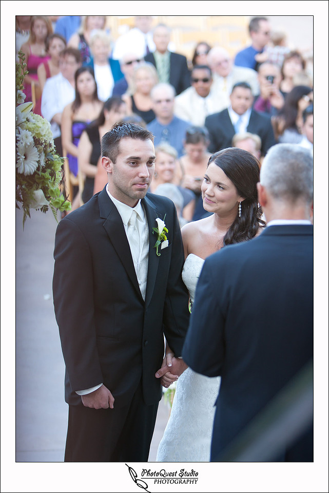 South Coast Winery Wedding Photography by Temecula, Menifee, Murrieta Wedding Photographer. bride looking at her groom during the ceremony