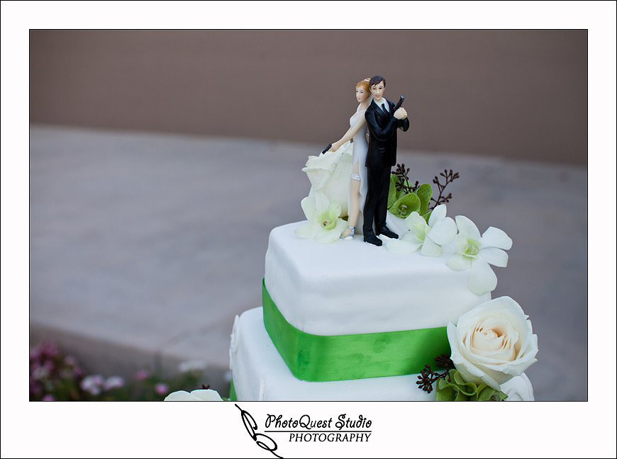 South Coast Winery Wedding Photography by Temecula, Menifee, Murrieta Wedding Photographer. The cake top with guns