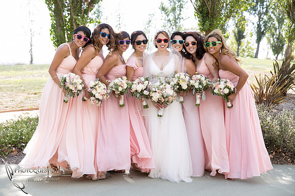the bride and the bridal party with color sun glasses