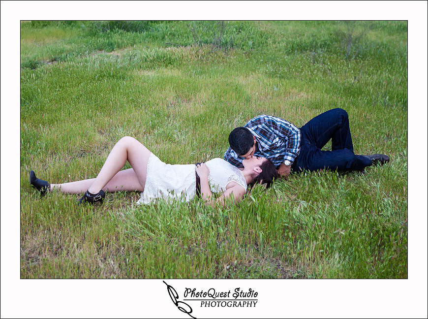 Romantic Temecula Old Town and Fallbrook Sunset Engagement Photo Session by Menifee, Temecula Wedding Photographer - Future Bride and Groom kissing on the grass