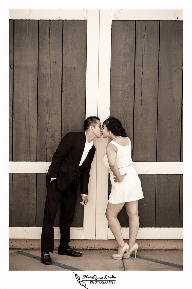 Romantic Temecula Old Town and Fallbrook Engagement Photo Session by Menifee, Temecula Wedding Photographer - Future Bride and Groom kissing by the big doors