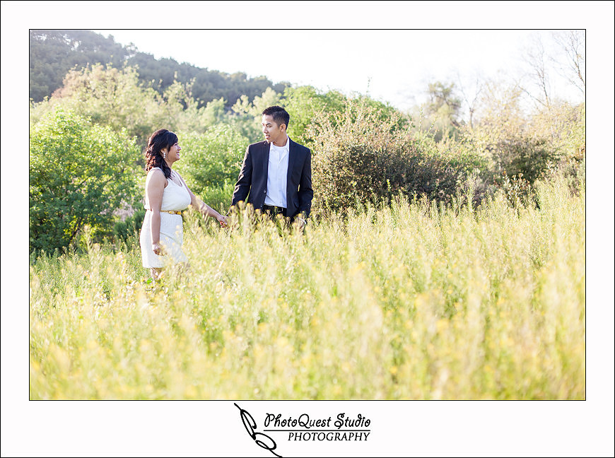 Romantic Temecula Old Town and Fallbrook Engagement Photo Session by Menifee, Temecula Wedding Photographer - Future Bride and Groom walking in tall grass