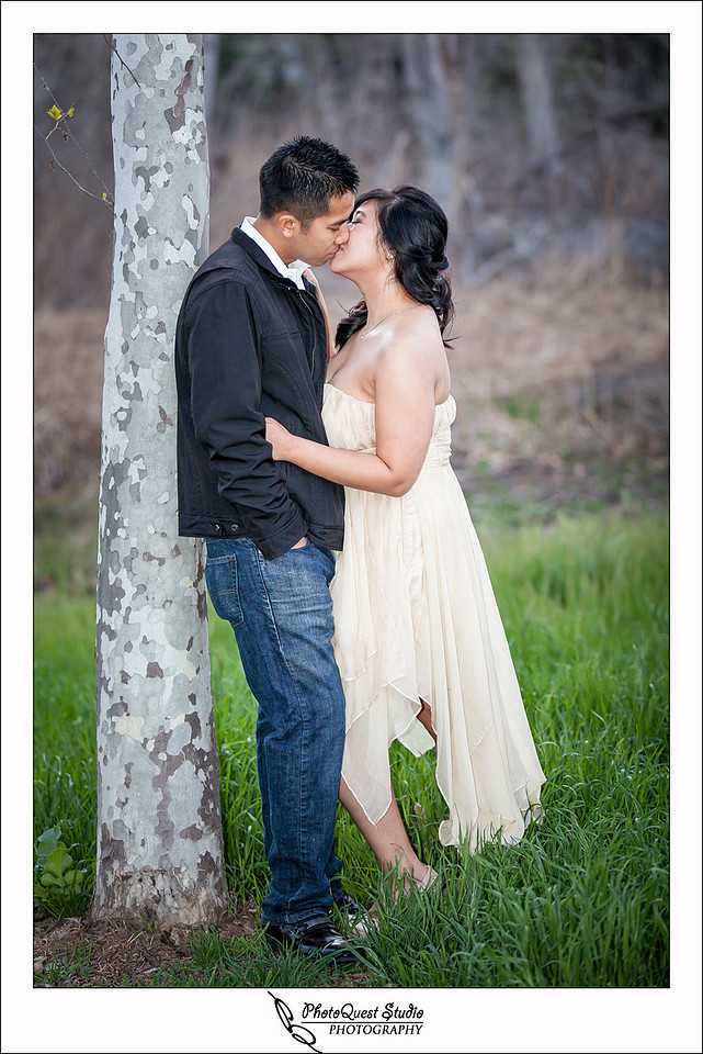 Romantic Temecula Old Town and Fallbrook Engagement Photo Session by Menifee, Temecula Wedding Photographer - Future Bride and Groom kissing by the tree