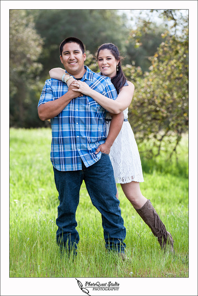 Valley Center Mountain Top Engagement Photo Session by Menifee wedding photographer, Murrieta wedding photographer, Temecula Wedding Photographer, Valley center wedding photographer - Future Bride hanging on to future Groom