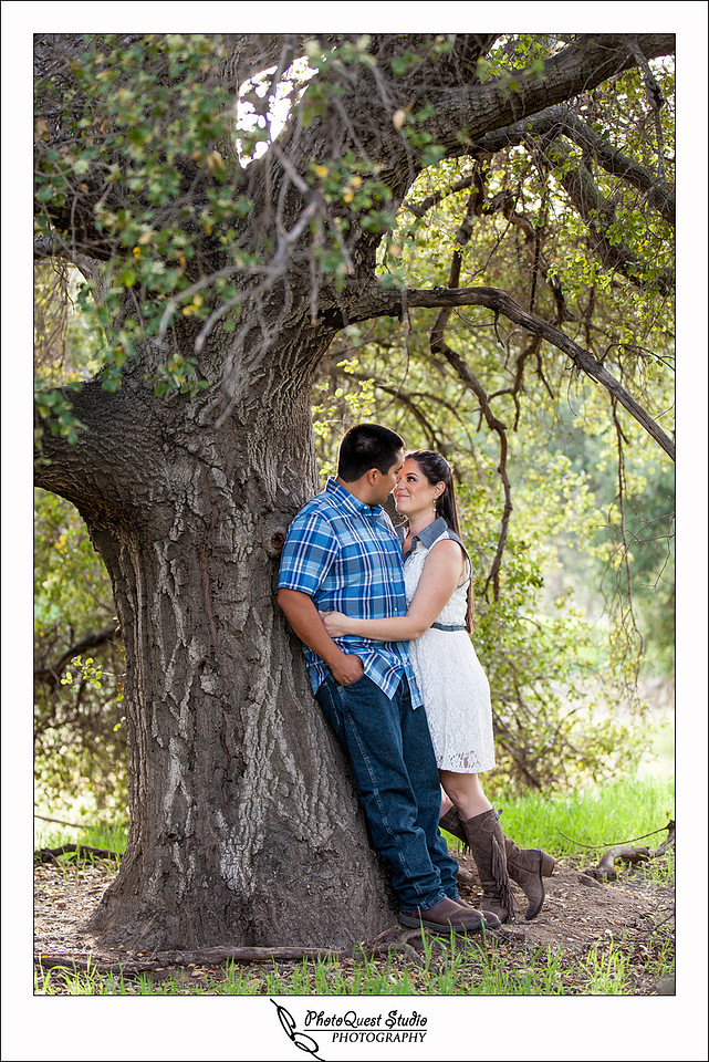 Valley Center Mountain Top Engagement Photo Session by Menifee wedding photographer, Murrieta wedding photographer, Temecula Wedding Photographer, Valley center wedding photographer - J & L in each other arm under the big tree