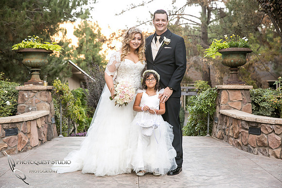 Bride and Groom with their daughter by Fallbrook, Temecula Wedding Photographer