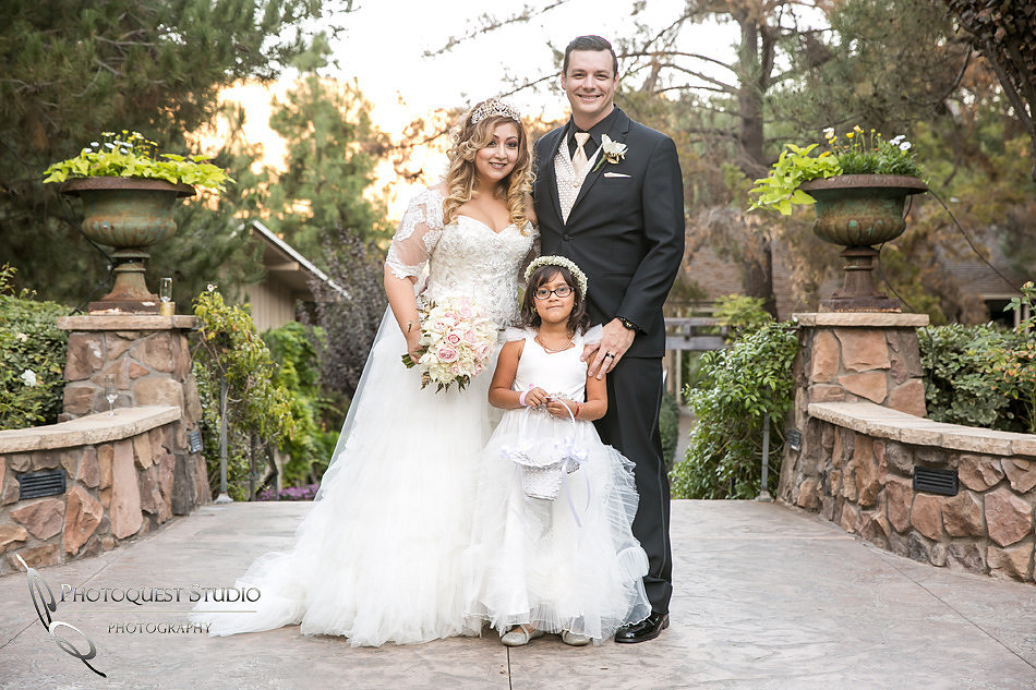 Bride and Groom with their daughter by Fallbrook, Temecula Wedding Photographer