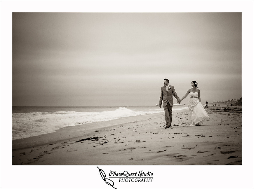 Carlsbad Beach Wedding by Temecula Wedding Photogarpher of Photoquest Studio, Photography, bride and groom walking on carlsbad beach