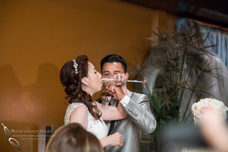 Bride and groom cheering champagne at Brodard Chateau Wedding