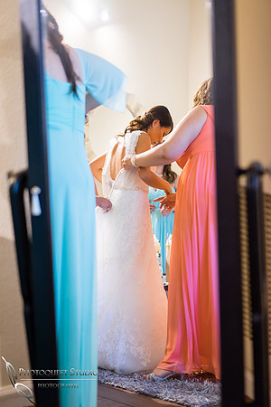 Monica putting on wedding dress