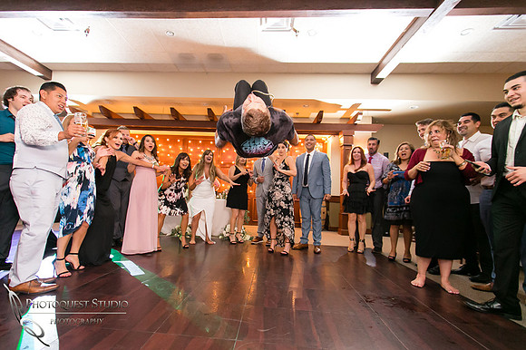 Flipping Wedding Photo at Wiens Family Cellars  by Temecula Wedding Photographer