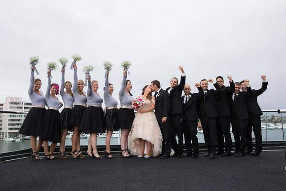 Kissing-and-cheer-Newport-Beach-Wedding-Electra-Cruises