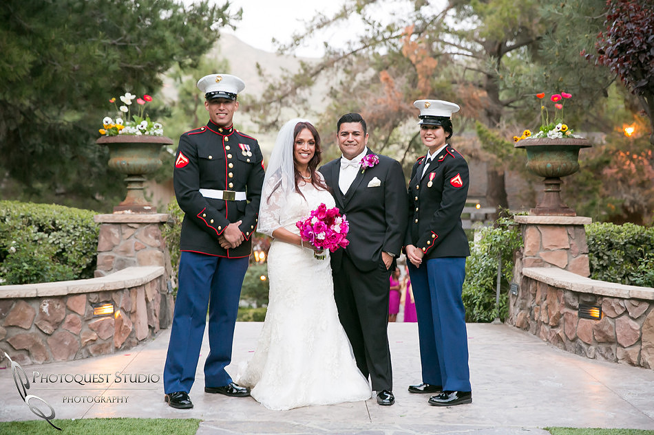the bride and groom and the military couple