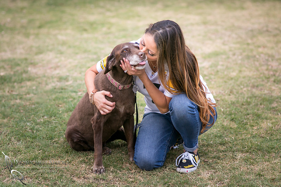 Kissing baby dog at Fairmount Park Engagement Photo Davina & Steve