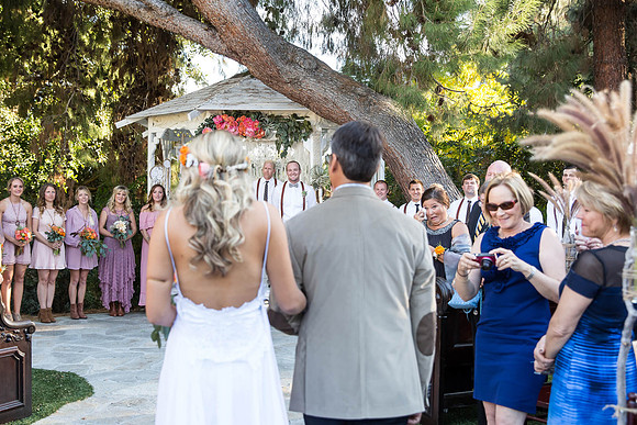 Groom-looking-at-the-bride-entering-the-ceremony-Green-gables-Estate-San-Diego-Wedding