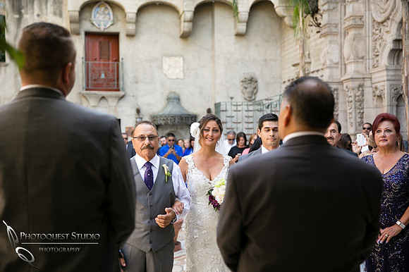 Bride wink at the groom at Mission Inn Hotel Wedding