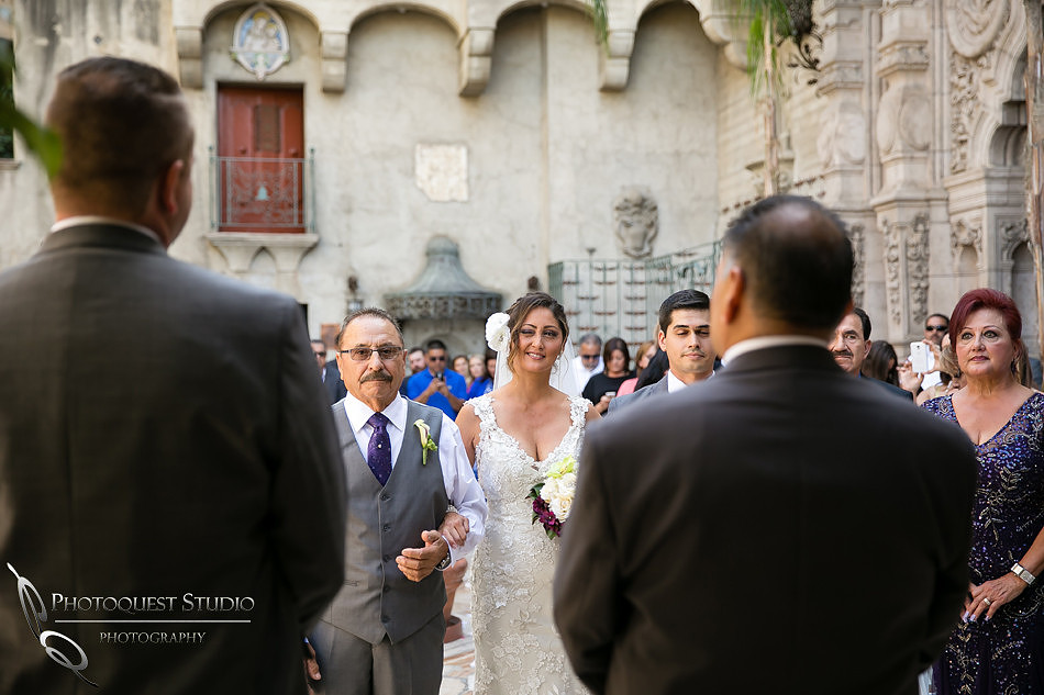Bride wink at the groom at Mission Inn Hotel Wedding