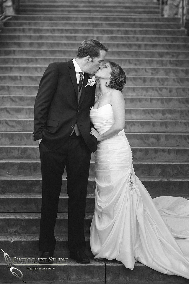 Kissing by the stair at pala mesa resort