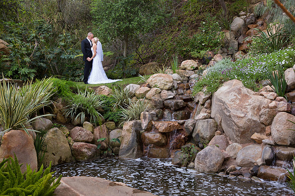 Kissing-by-the-waterfall-by-Temecula-Wedding-Photographers