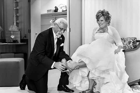 Pechanga Casino Resort The Journey Eagles Nest Wedding byTemecula Menifee Murrieta Wedding Photography Groom put on shoes for the Bride