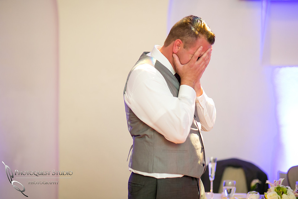 Handling the surprise at Mission Inn Hotel Wedding Photo by Riverside-Temecula Wedding Photographer