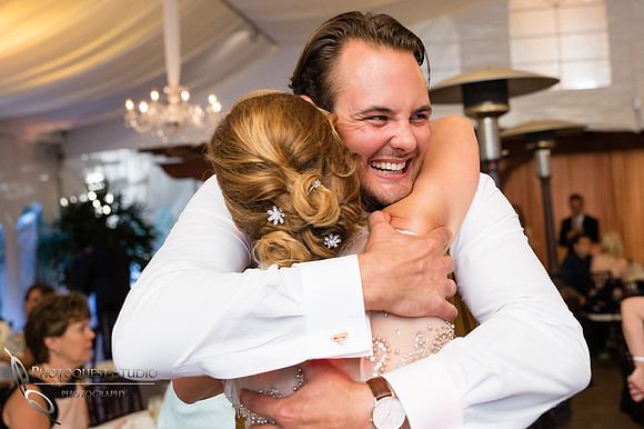 the groom hugging his mother in law