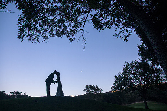 Kissing under the moon by Temecula Wedding Photographer at Temecula Creek Inn