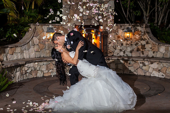Kissing and dipping at Grand Tradition Fallbrook Wedding