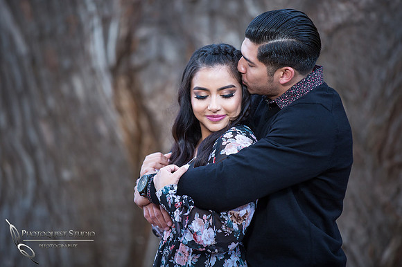 Kissing her at Engagement by Temecula wedding photographer