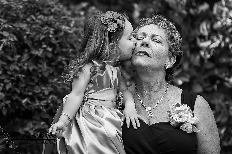 Granddaughter kissing grandma
