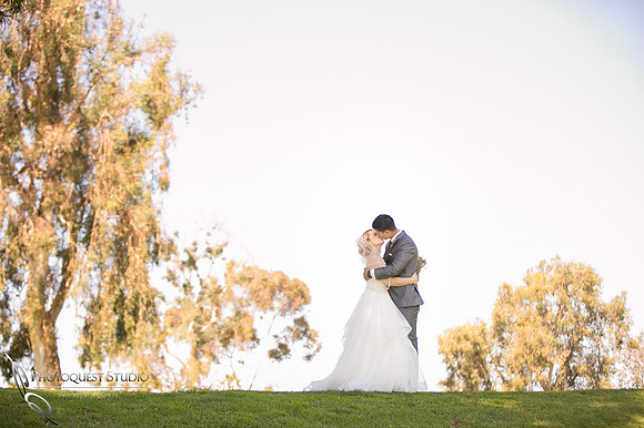 Kissing her - Temecula wedding photographer at Wedgewood San Clemente