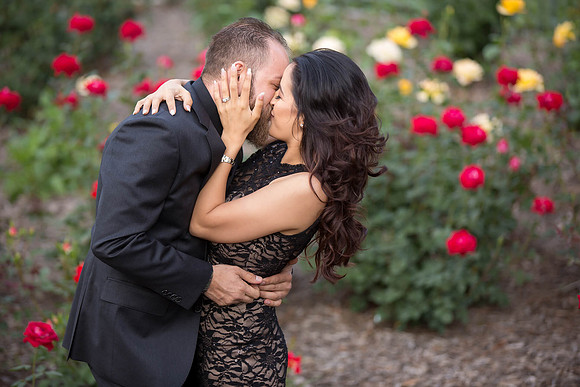 Kissing in the rose garden by Wedding Photographer in Temecula