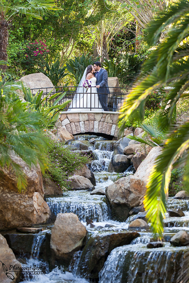 bride and groom kissing at the famous bride and water fall at grand tradition estate fallbrook wedding