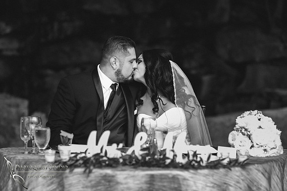 Bride and Groom kissing in black and white