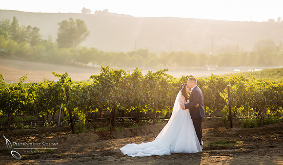 Kissing by Temecula wedding photographer
