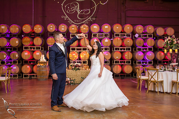 Bride and groom dancing in barrel room