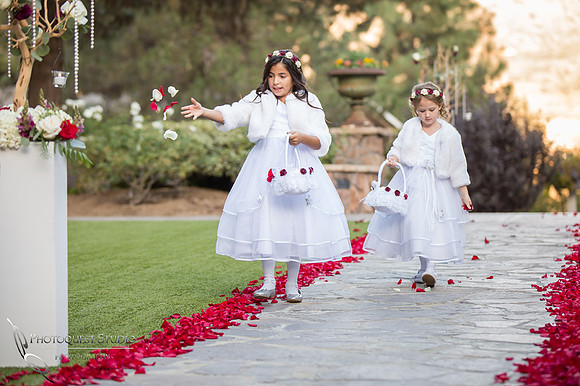 Flower girls in white dresses
