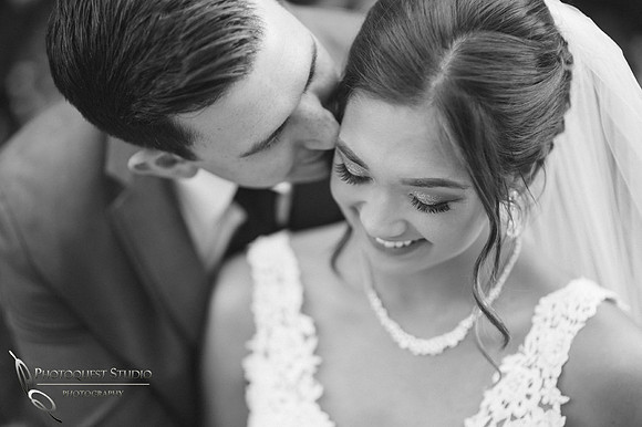 Kissing her by Wedding photographer in Temecula