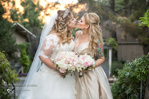 Bride and Bridesmaid kissing by Fallbrook, Temecula Wedding Photographer