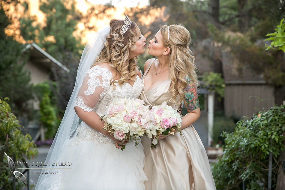 Bride and Bridesmaid kissing by Fallbrook, Temecula Wedding Photographer