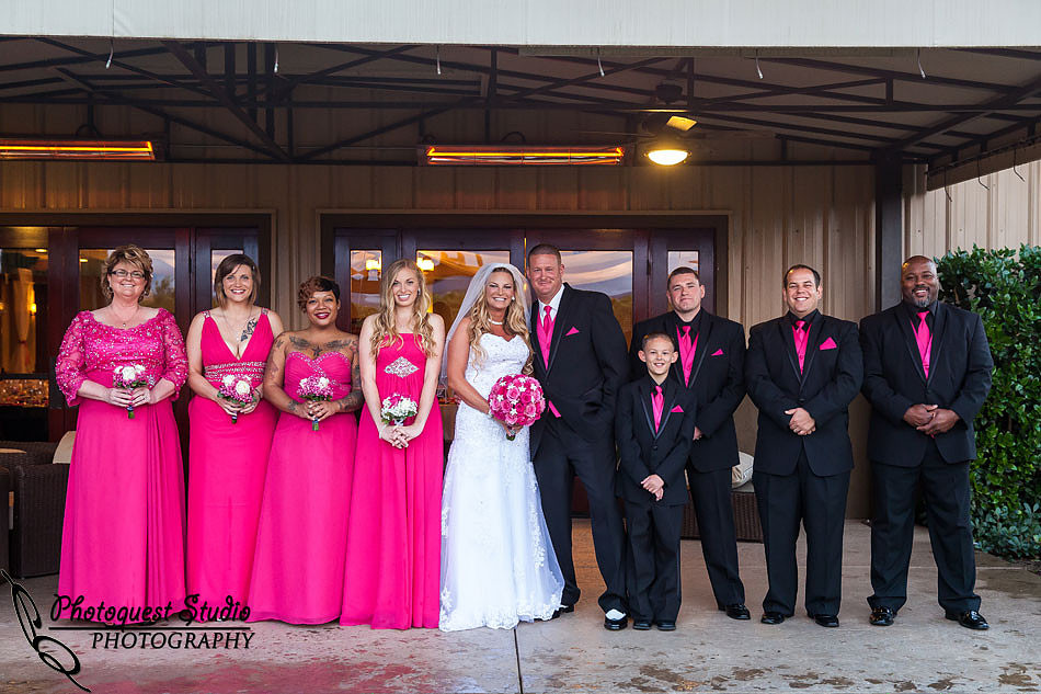 bride and groom and bridal party formal portrait at Wiens family cellars temecula winery by temcula wedding photographer