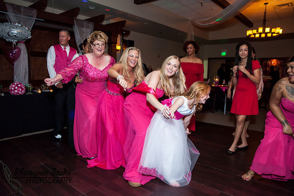 mother and daughter and granddaughter dancing at Wiens family cellars temecula winery by temcula wedding photographer