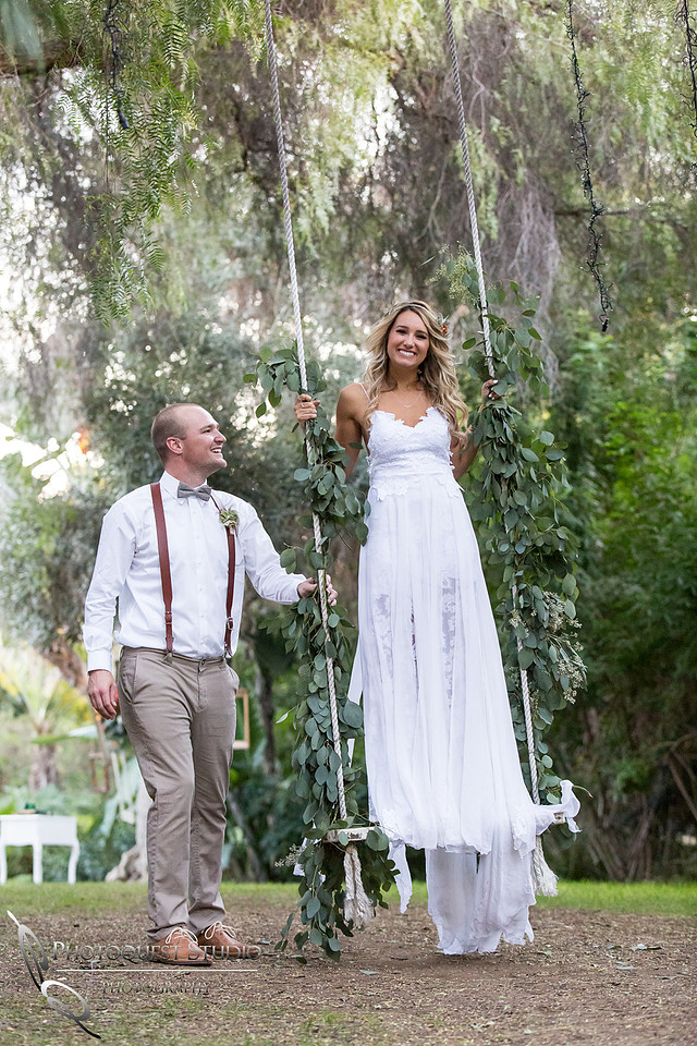 pushing her on the swing at Green Gables Estate, San Diego Premier Wedding by Temecula Wedding Photographer of Photoquest Studio Mel + Brendan Wedding